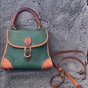 Dooney and Burke loved Green and Tan Leather Top-Handle Satchel.